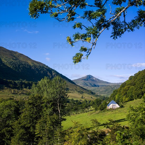 Mountains of Cantal with a barn in foreground