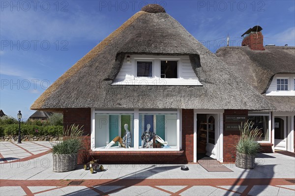 Fashion boutique in house with thatched roof