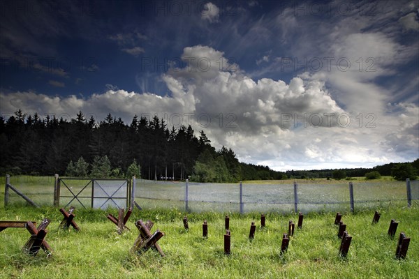 Border fortification with motor vehicle barrier