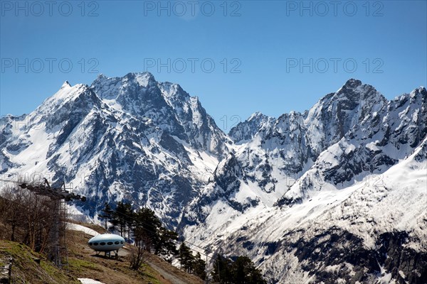 Snowcapped mountains against clear blue sky