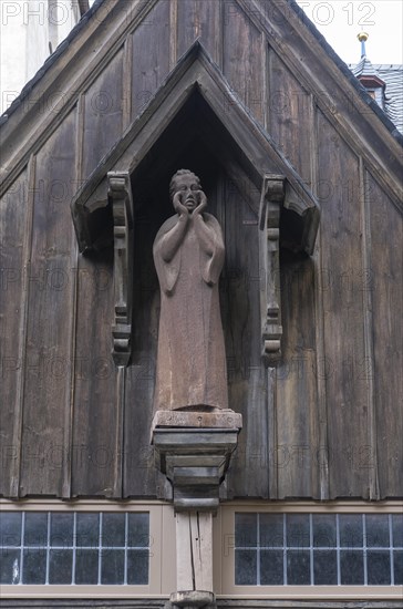 Wooden figure of John the Baptist above the portal of the Protestant St. John's Church in Wernigerode