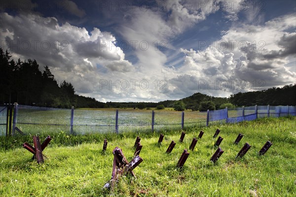 Border fortification with motor vehicle barrier