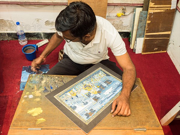 Artist creates traditional miniature painting