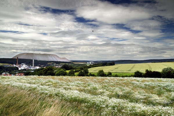 View over fields to village and overburden salt dump