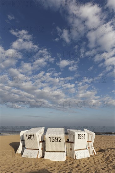 White beach chairs in the morning light