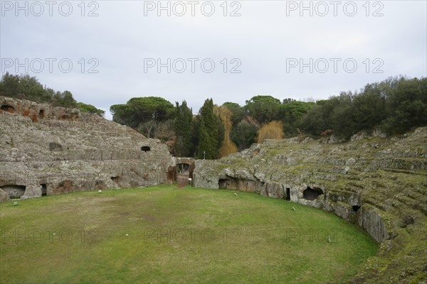 Roman amphitheatre carved out of the tufa