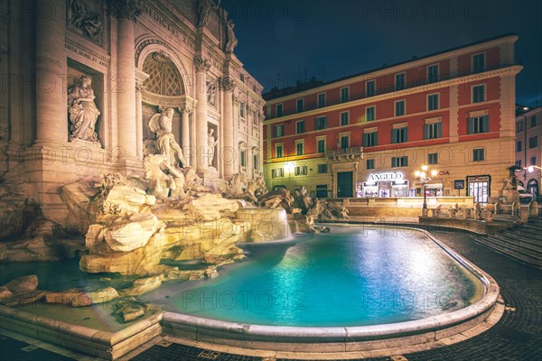 Illuminated fountain at night