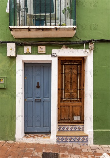 Close-up of doors of green fishermen's house in Villajoyosa