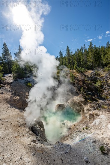 Hot steaming spring with blue water