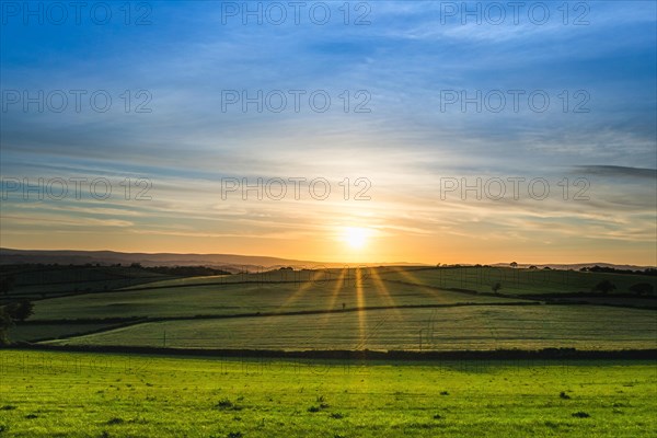 Sunset over fields in Berry Pomeroy Village