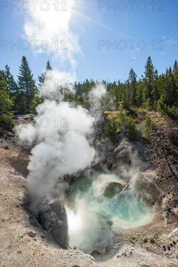 Hot steaming spring with blue water