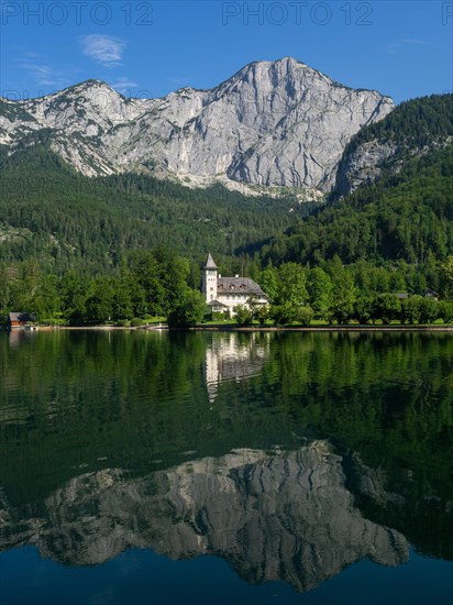 Grundlsee Castle against a mountain backdrop