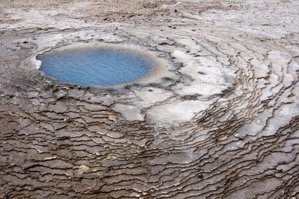 The Blahver hot spring surrounded by sinter terraces near Hveravellir