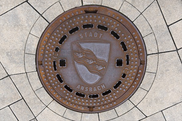 Manhole cover with city coat of arms