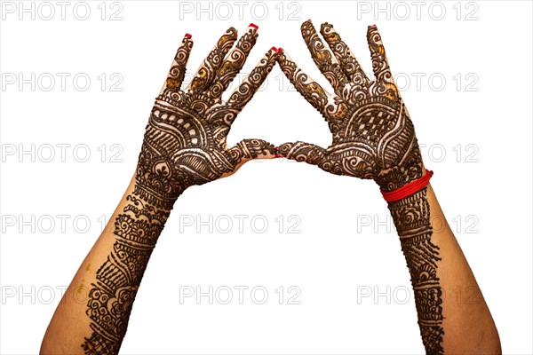 Indian Bride's hand painted with mehndi isolated on white background. Mauritius