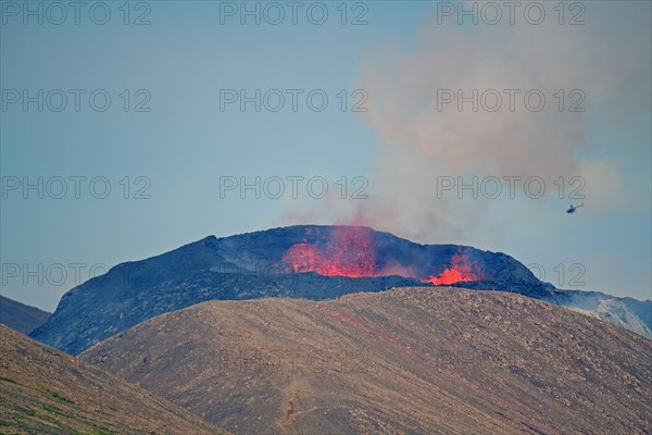 Active volcano with lava fountains