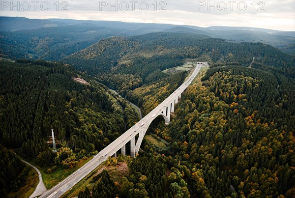 Motorway A71 in front of Rennsteig tunnel in the background Schneekopf