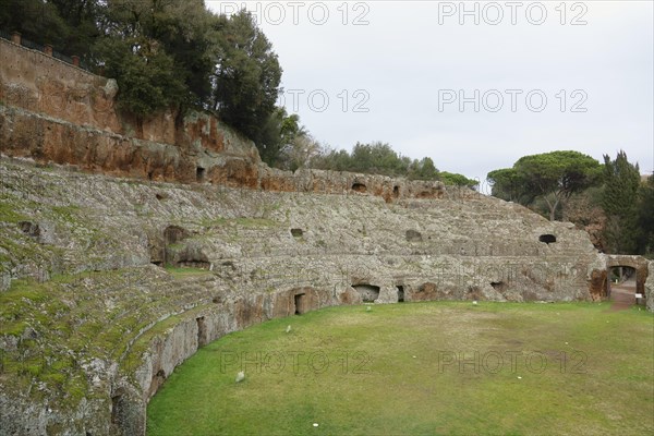 Roman amphitheatre carved out of the tufa