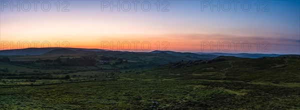 Sunset over fields in Haytor Rocks