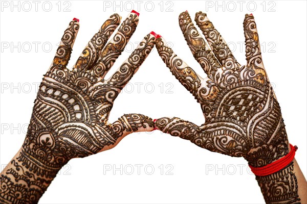 Indian Bride's hand painted with mehndi isolated on white background. Mauritius