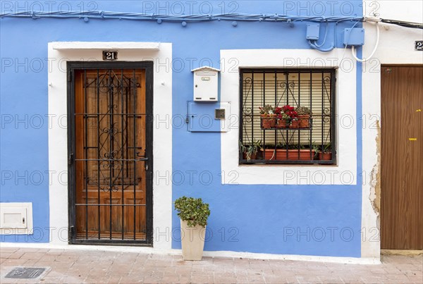 Close-up of door and window of blue fishermen's houses in Villajoyosa