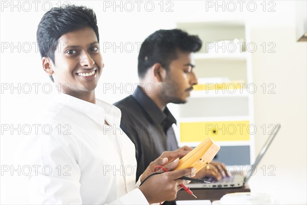 Students in an internship at the university with work equipment