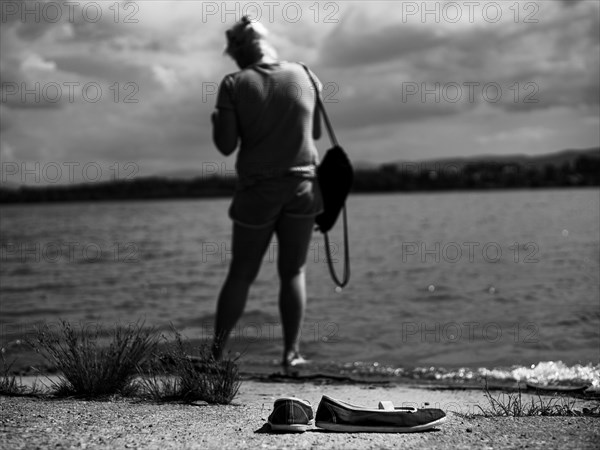 Women espadrilles on the lakeside