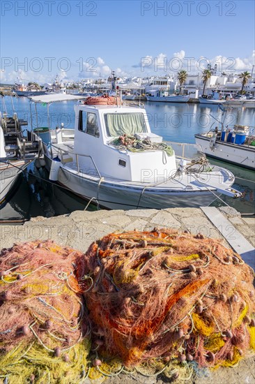 Harbour with fishing boat and nets