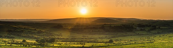 Sunset over fields in Haytor Rocks