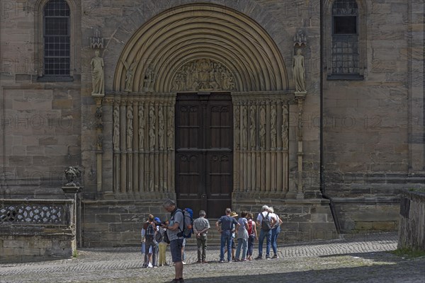 Tourists in front of the prince's portal around 1230