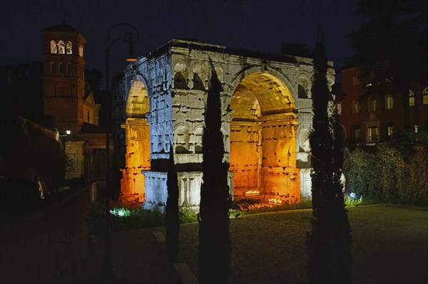 Illuminated Arch of Janus at night