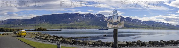 Panorama of Vopnafjoerour harbour with monument to emigrants