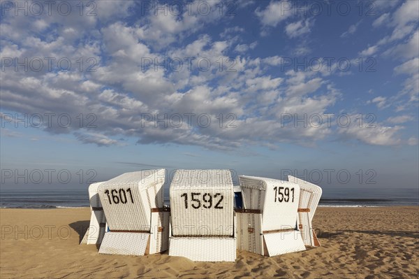 White beach chairs in the morning light