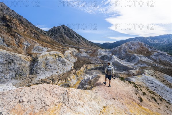 Young man at the crater rim