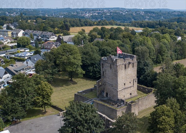 Fortified castle tower of ruin of partly reconstructed former moated castle Burg Altendorf from the Middle Ages