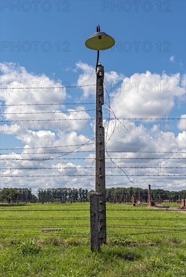 Barbed-wire fence and lamp-post at Auschwitz II-Birkenau concentration camp