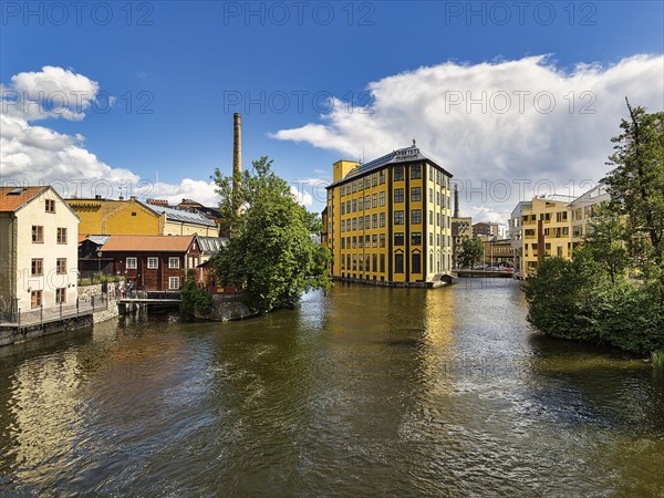 Former factory building Styrkjaern on the island of Laxholmen in the Motala stroem river