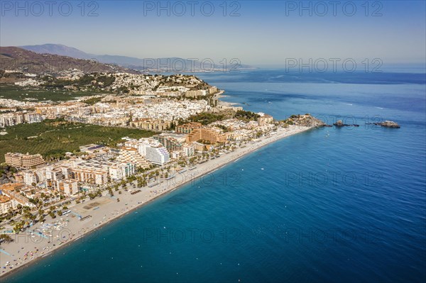 Aerial view of touristic coast in Almunecar by Mediterranean Sea