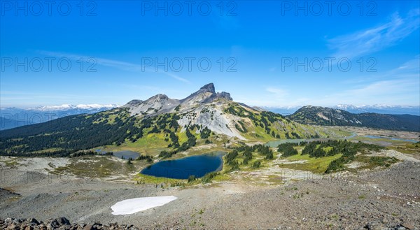 Blue lakes in front of Black Tusk volcanic mountain