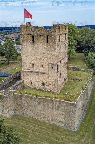 Fortified castle tower of ruin of partly reconstructed former moated castle Burg Altendorf from the Middle Ages