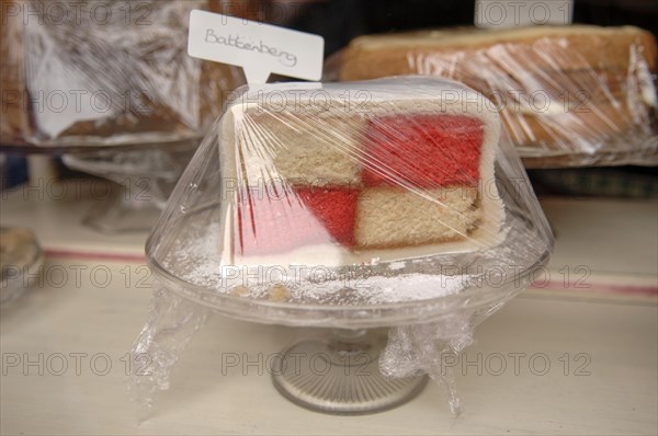 Pie wrapped in cellophane in a shop window