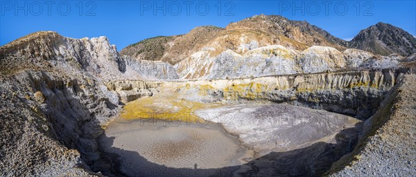 Crater with yellow discoloured sulphur stones