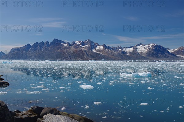 View of a fjord filled with drift ice