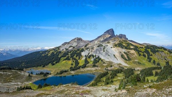 Blue lakes in front of Black Tusk volcanic mountain