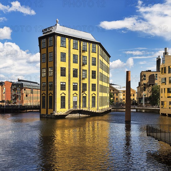 Former factory building Styrkjaern on the island of Laxholmen in the Motala stroem river