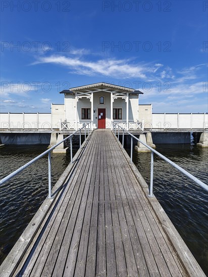 White cold bathhouse by the Baltic Sea