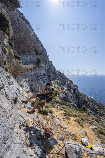 Climbing a rock face