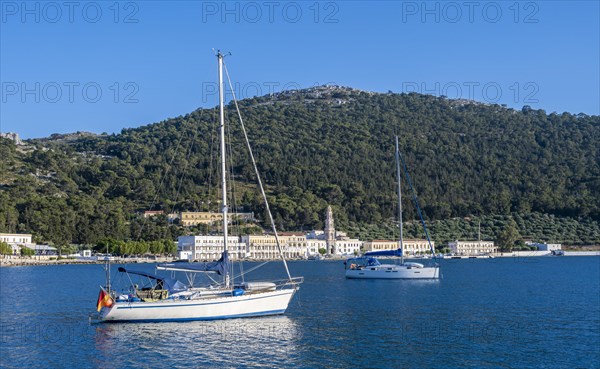 Two sailboats in the bay of Panormitis