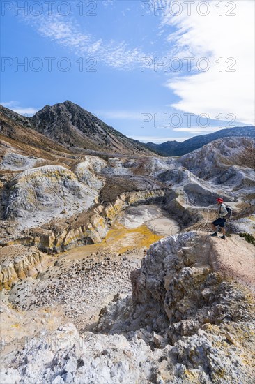 Young man at the crater rim