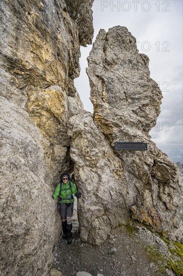 Hiker in a rock hole